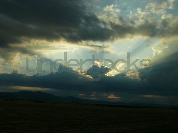 understocks-sunset-sunbeam-clouds-landscape-photo-stock